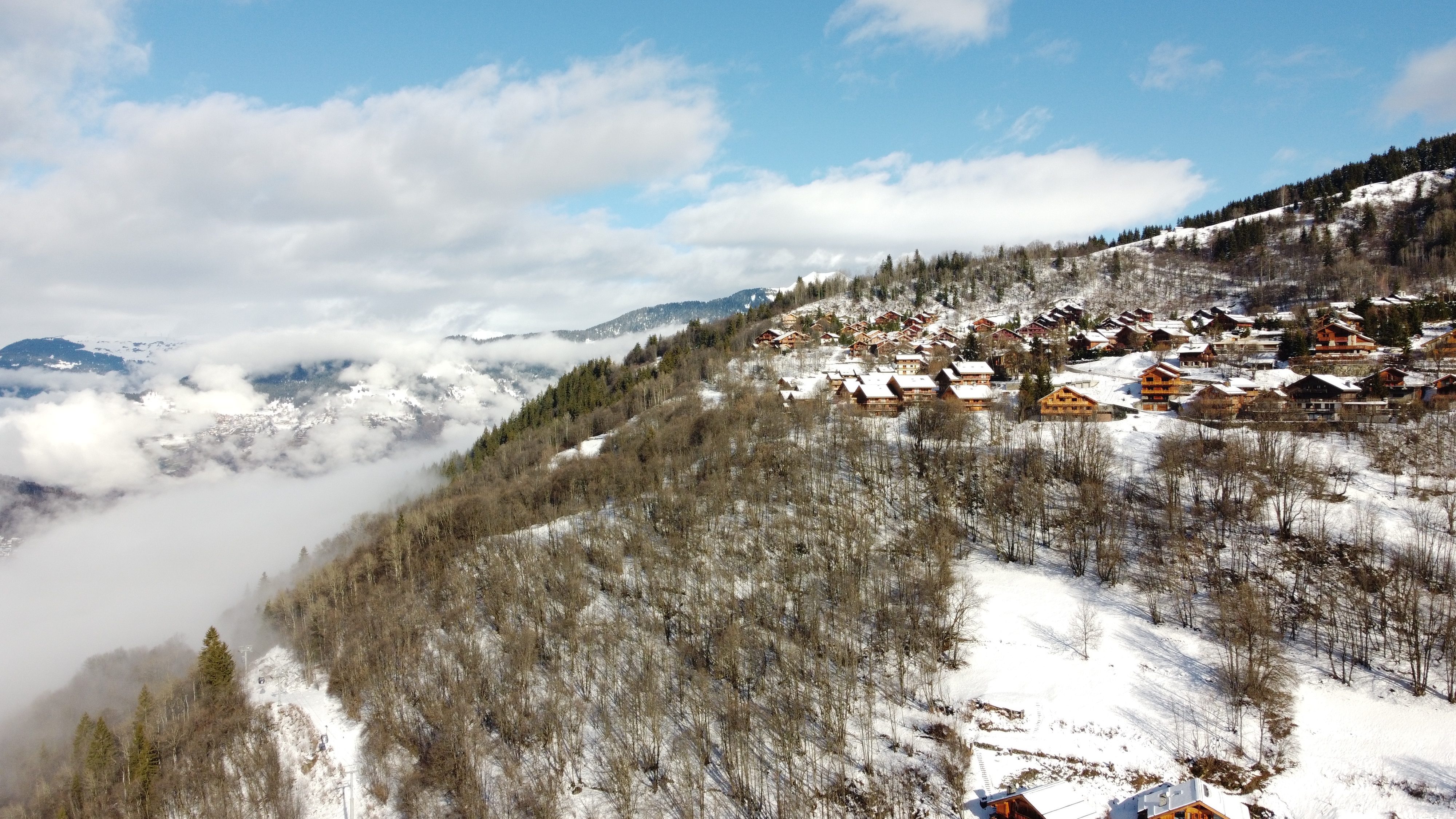 Aerial drone view of alpine village in winter