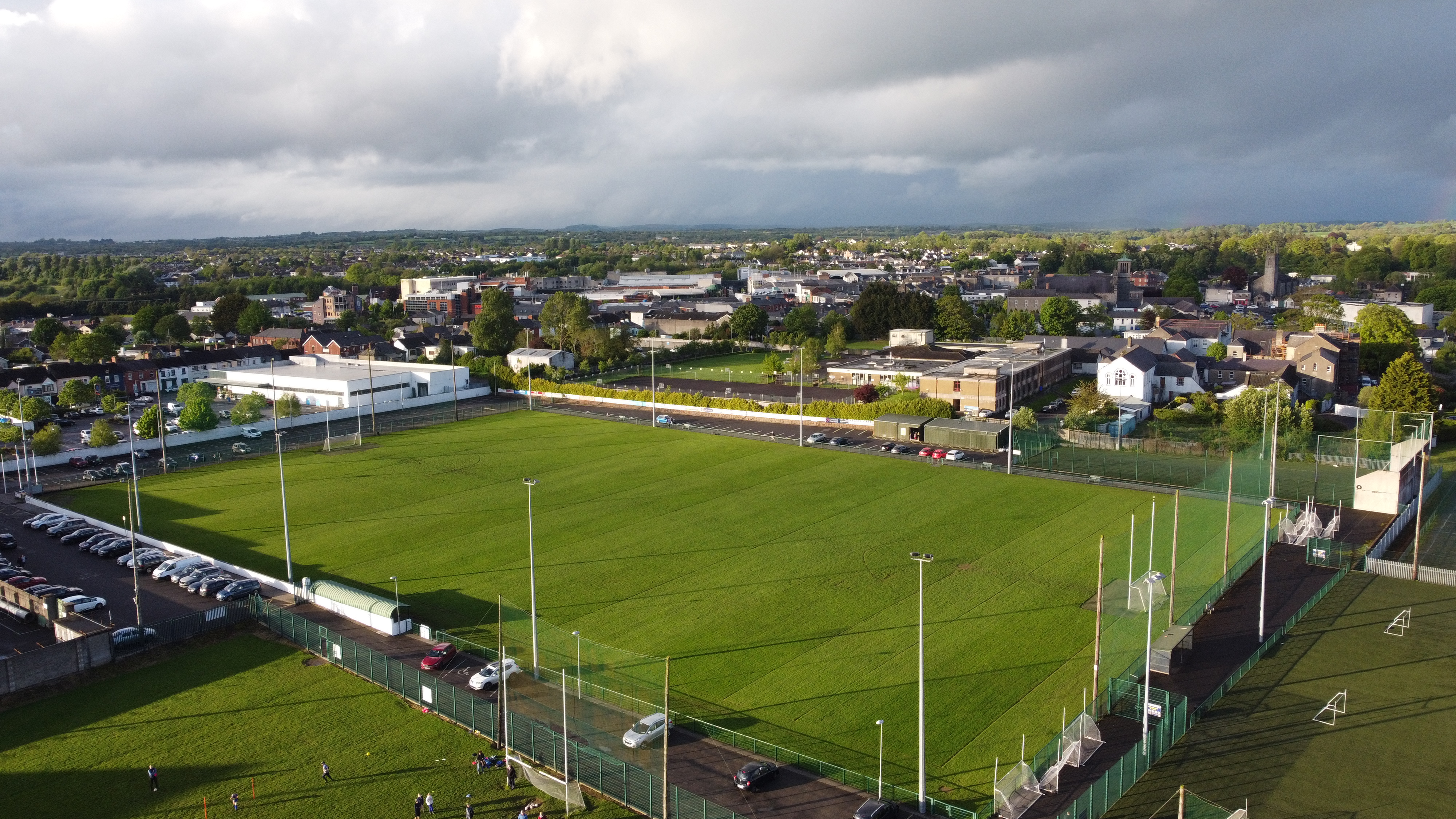 Aerial view of GAA grounds with town backdrop, Ireland